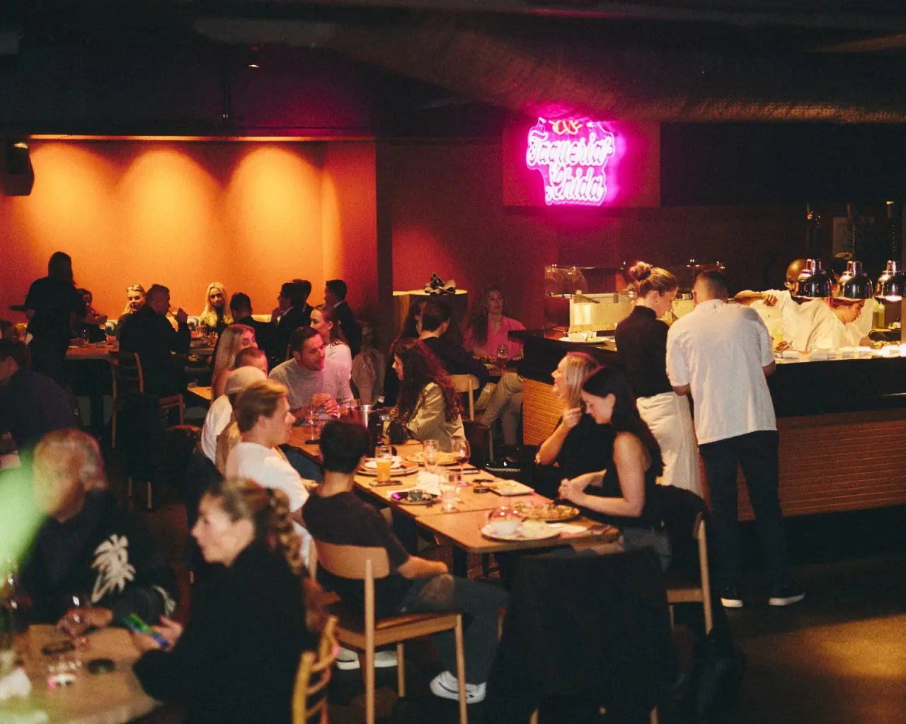 Guests and staff in the dining room at Paleet