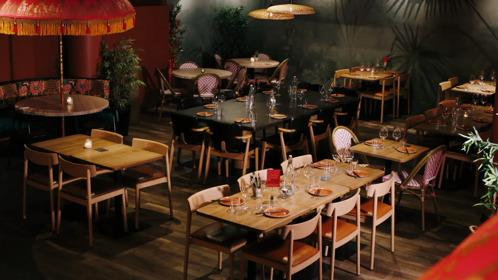 Set dining tables and warm lighting at Paleet