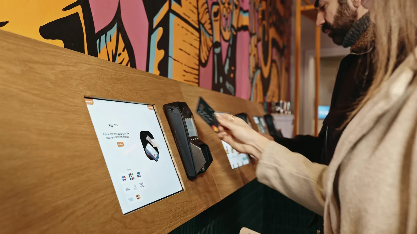 A guest using a ninito self-service kiosk in a restaurant